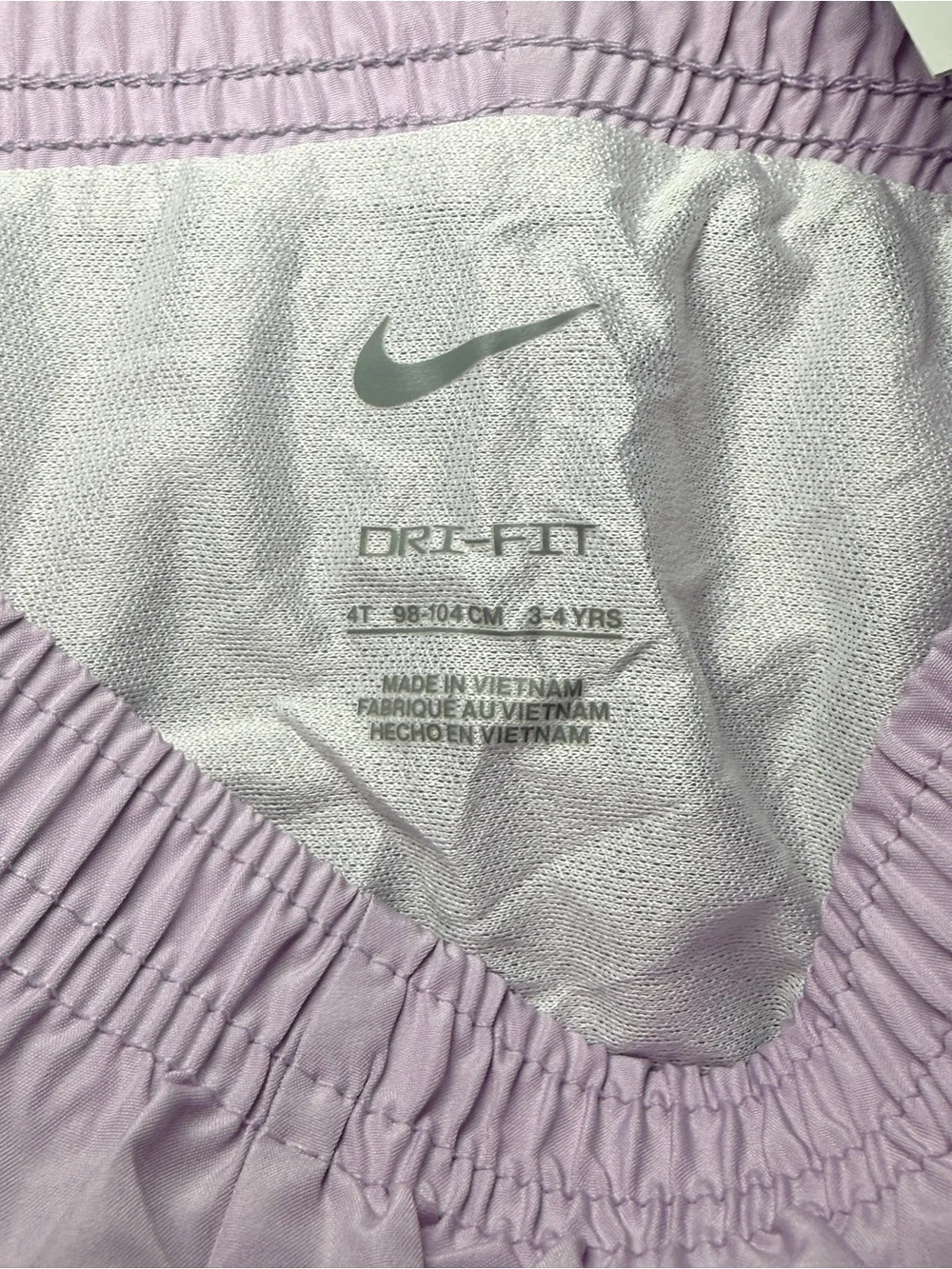 Nike Light Pink Women's Athletic Running Shorts with White Swoosh